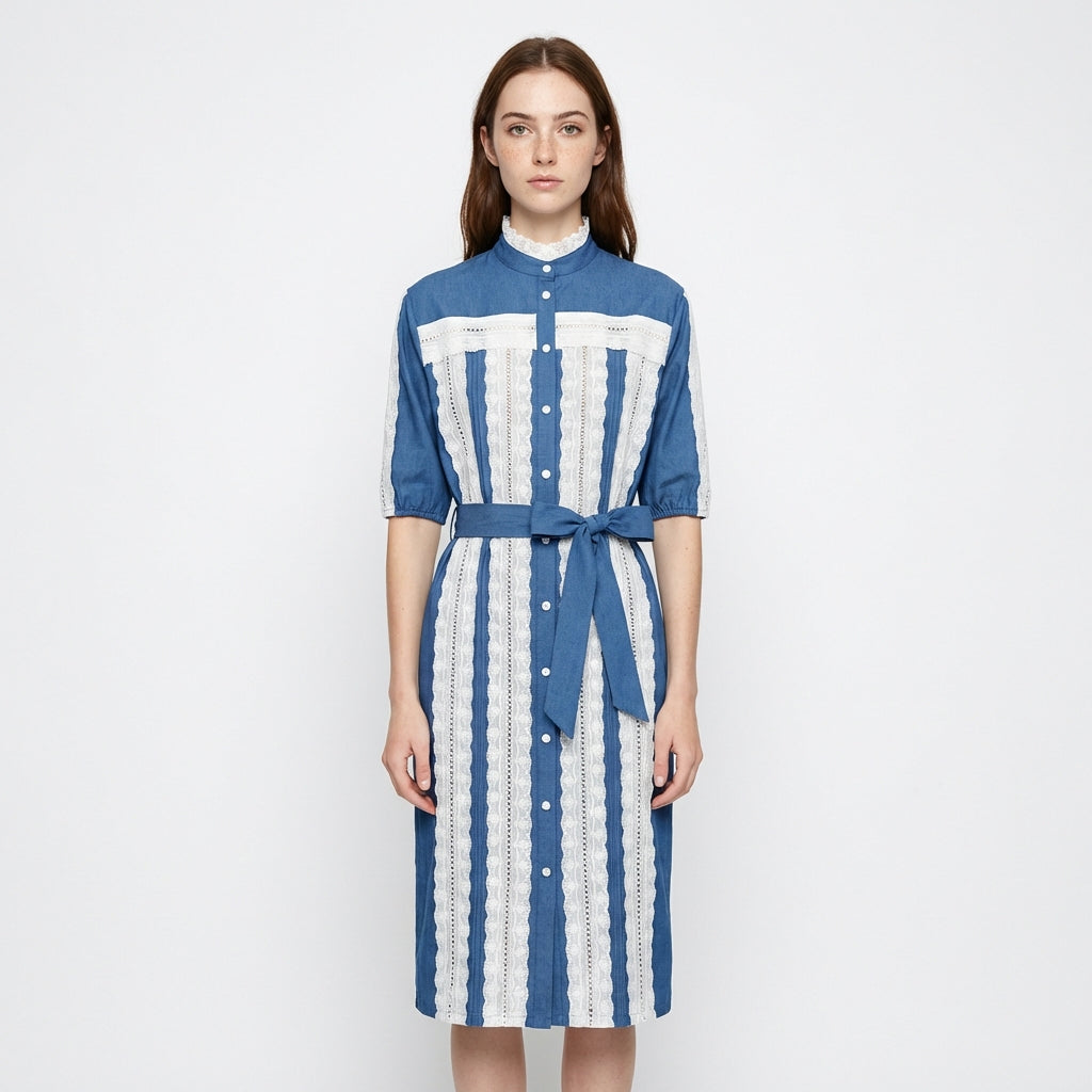Woman wearing a blue and white striped dress on a white background
